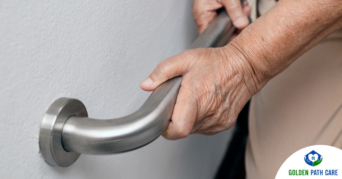 An older adult uses a grab bar representing one of the home modifications that is helpful for fall prevention for elderly adults.
